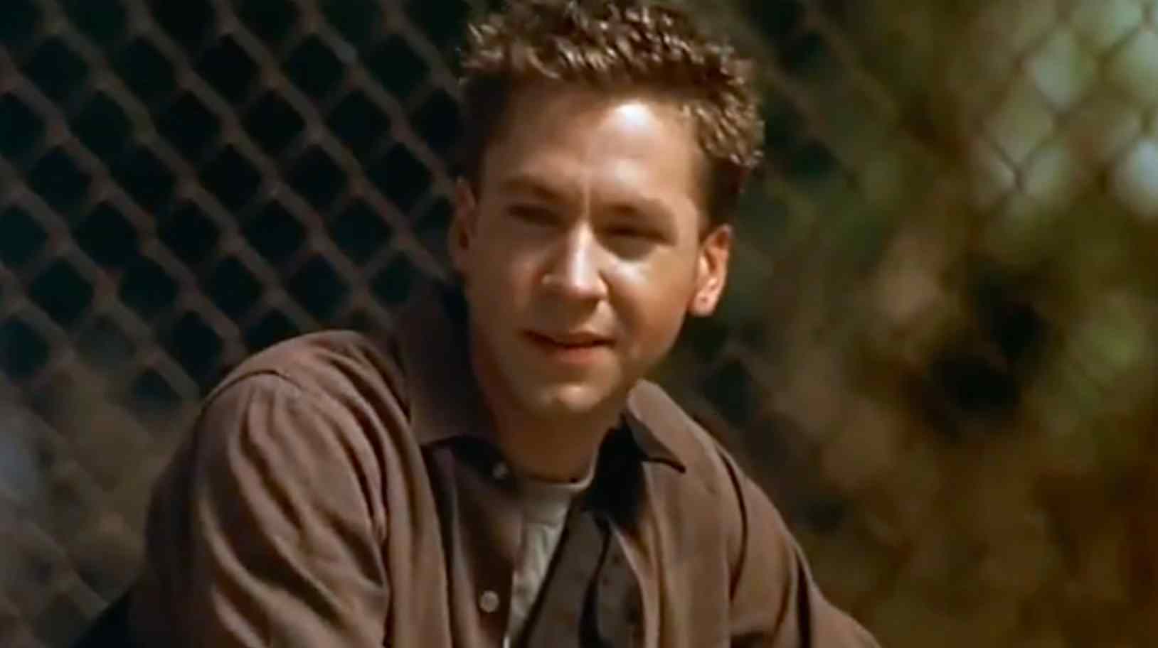 Brett (Michael Weston) sitting on the bleachers in the 2002 Danny Graves, Richard Wenk film Wishcraft.